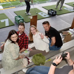 Friends on the bleachers posing for a picture