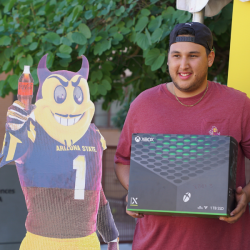 2024 Championship winner holding his Xbox console 
