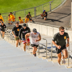 Guests running up the bleachers