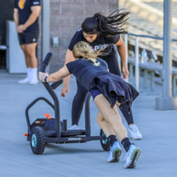 Woman pushing weight on the concourse
