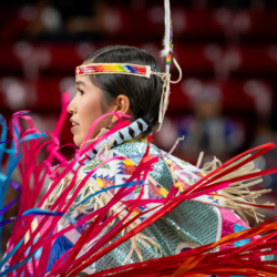 Pow Wow performer in various colors. Photo by Tim H. Murphy.