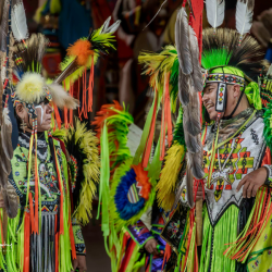 Pow Wow performers in green. Photo by Tim H. Murphy.