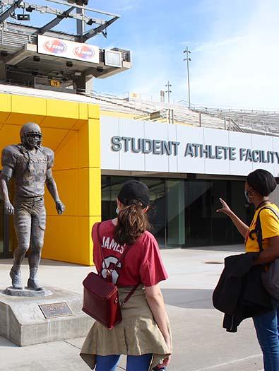 Student Stadium tour at Sun Devil Stadium, students admire Pat Tillman Statue