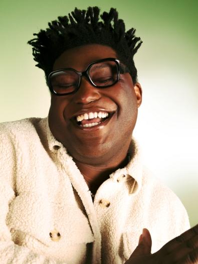 Larry Owens; a man smiling with his eyes closed
