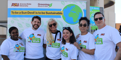Guests in front of ASU Sustainability step and repeat
